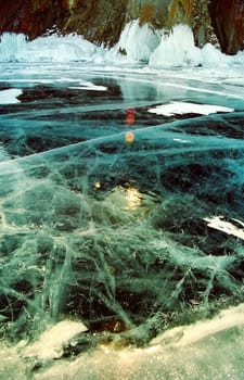 Winter on the Baikal, ice and snow on the lake. The beauty of the nature of Baikal in winter.