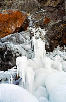 Winter on the Baikal, ice and snow on the lake. The beauty of the nature of Baikal in winter.