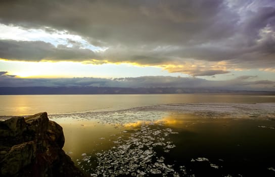 Spring on Baikal, ice and snow on the lake melt. The beauty of the nature of Baikal in the early spring.