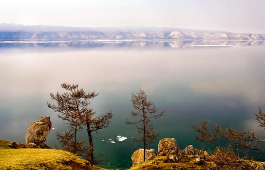Spring on Baikal, ice and snow on the lake melt. The beauty of the nature of Baikal in the early spring.