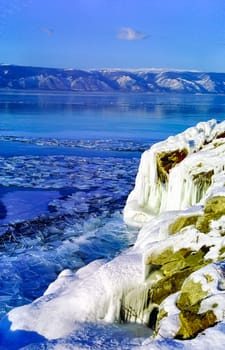 Winter on the Baikal, ice and snow on the lake. The beauty of the nature of Baikal in winter.
