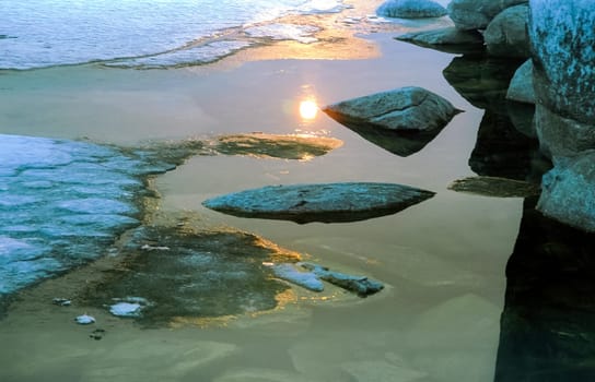 Winter on the Baikal, ice and snow on the lake. The beauty of the nature of Baikal in winter.