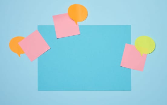 Blank rectangular sheet of paper on a blue background, coy space
