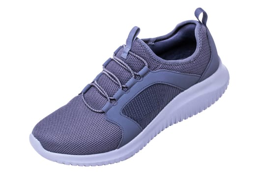 Closeup of a pair of modern silver gray sneakers or sports shoes isolated on a white background. Clipping path. Elegant and trendy mans shoes. Macro.
