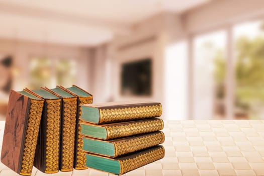 Books backgrounds. Closeup of a stack or pile antique books on a table over abstract blurred home office. Education concept. Teacher day.