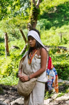 Tayrona, Magdalena, Colombia - September 21 2023: Indigenous Koguis girl in the road to Ciudad Perdida, Magdalena, Sierra Nevada de Santa Marta, Colombia