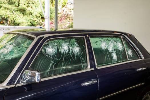 Medellin, Colombia - December 9, 2023: Car shot up of famous drug dealer Pablo Escobar in Open-air museum.