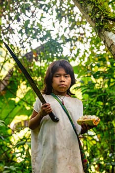 Tayrona, Magdalena, Colombia - September 21 2023: Indigenous Koguis boy in the road to Ciudad Perdida, Magdalena, Sierra Nevada de Santa Marta, Colombia