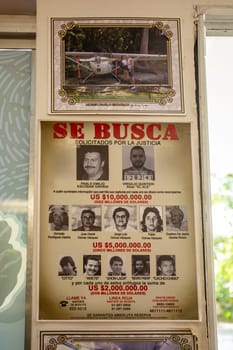 Medellin, Colombia - December 9, 2023: A list of rewards for drug dealers in open-air museum of famous drug dealer Pablo Escobar.