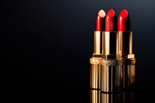A trio of red lipsticks on a base in gold glitter cases.