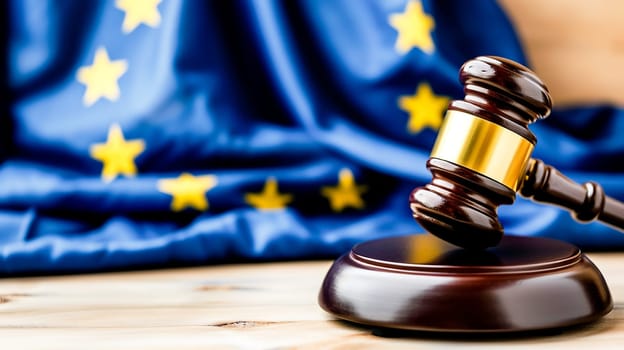 A judge's gavel rests authoritatively in front of the star-studded European Union flag.Judicial Power of Europe. Suitable for articles on EU law, legal research and educational materials