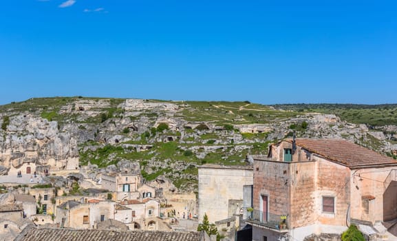 Matera, Italy - 6 May 2023: Ancient Unesco heritage old town of Matera (Sassi di Matera), Basilicata, southern Italy. Prehistoric cave dwellings