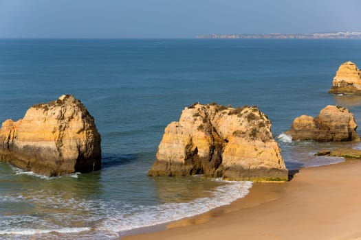The famous beach of Praia da Rocha in Portimao. This beach is a part of famous tourist region of Algarve.