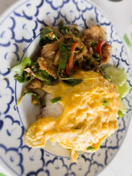 Spicy Thai basil with pork and egg, stock photo
