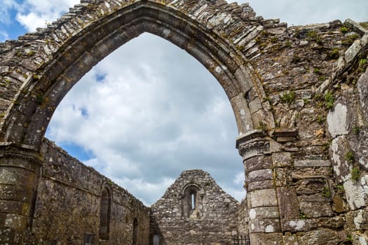 Detail of the St Declan's Monastery whose most important monuments are the 30m high round tower and the roofless cathedral