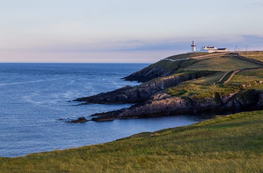 View to Galley Head Lighthouse on picturesque coastline in County Cork,Ireland.