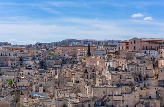 Matera, Italy - 6 May 2023: Old town of Matera (Sassi di Matera), Basilicata, southern Italy. Prehistoric cave dwellings