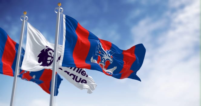 Selhurst, UK, October 2 2023: Crystal Palace football club and Premier League flags waving in the wind on a clear day. Illustrative editorial 3d illustration render. Waving flag