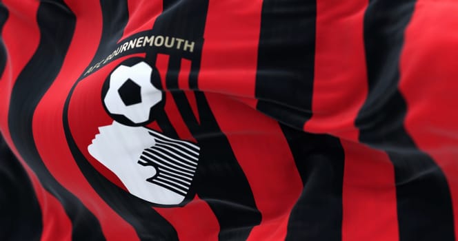 Bournemouth, UK, Sept. 4 2023: Close-up of AFC Bournemouth flag waving. English football club based in Kings Park, Boscombe. Illustrative editorial 3d illustration render. Selective focus