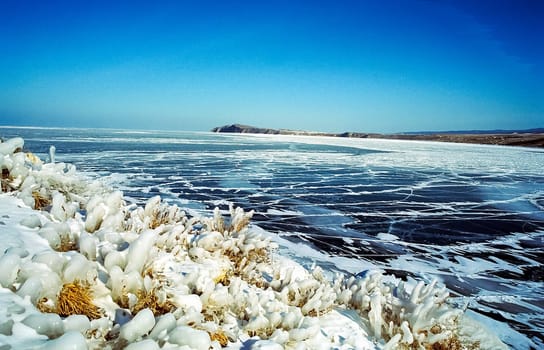 Winter on the Baikal, ice and snow on the lake. The beauty of the nature of Baikal in winter.