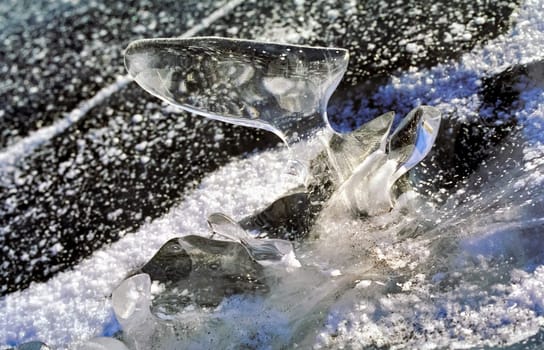Winter on the Baikal, ice and snow on the lake. The beauty of the nature of Baikal in winter.