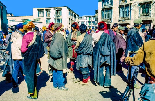 Lhasa, China - November 2, 1983: local people from the hills meet in the old part near the Jokhang palace in Lhasa, China.