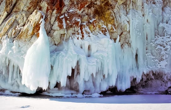 Winter on the Baikal, ice and snow on the lake. The beauty of the nature of Baikal in winter.