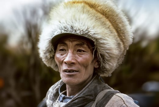 Lhasa, China - April 19, 1987: portrait of local people from the hills  in the old part near the Jokhan palace  in Lhasa, China.