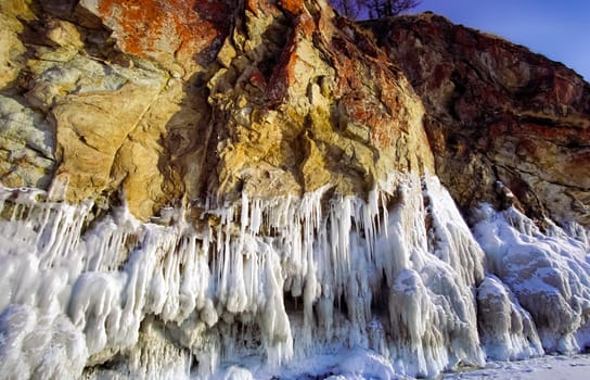 Winter on the Baikal, ice and snow on the lake. The beauty of the nature of Baikal in winter.
