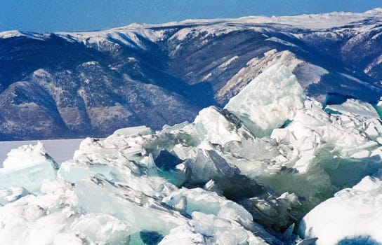 Winter on the Baikal, ice and snow on the lake. The beauty of the nature of Baikal in winter.