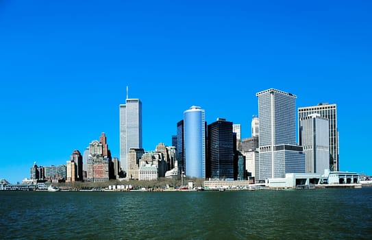 New York, USA - January 1, 1998: view to downtown Manhattan with skyline and World trade center under clear blue sky.