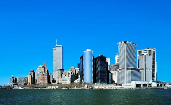 New York, USA - January 1, 1998: view to downtown Manhattan with skyline and World trade center under clear blue sky.