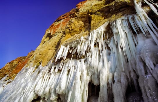 Winter on the Baikal, ice and snow on the lake. The beauty of the nature of Baikal in winter.