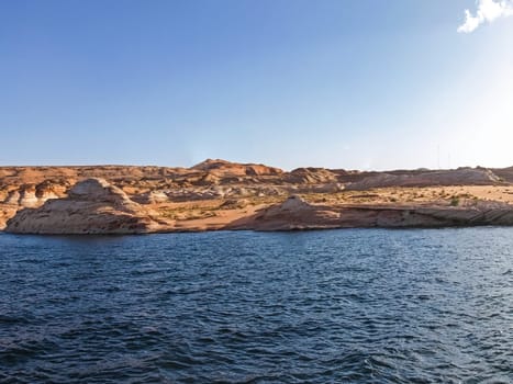 Lake Powell is based on Colorado River with a great view on the canyoon. Beautiful canyon and lonely rocks on the Lake Powell, Utah.