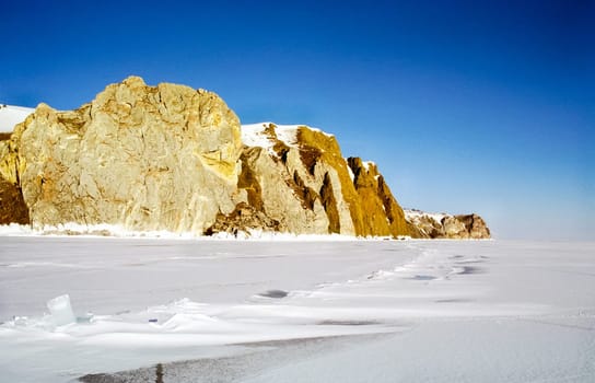 Winter on the Baikal, ice and snow on the lake. The beauty of the nature of Baikal in winter.