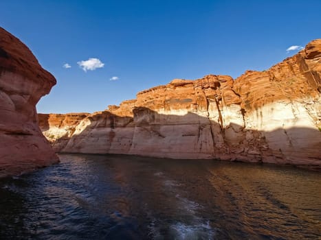Lake Powell is based on Colorado River with a great view on the canyoon. Beautiful canyon and lonely rocks on the Lake Powell, Utah.