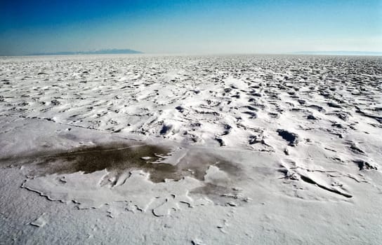 Winter on the Baikal, ice and snow on the lake. The beauty of the nature of Baikal in winter.