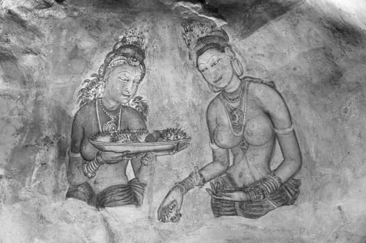 Sigiriya, Sri Lanka - August 9, 2005: Sigiriya Maidens fresco in Sigiriya, Sri Lanka. Sigiriya Maidens frescoes were painted at Sigiriya rock in five century.