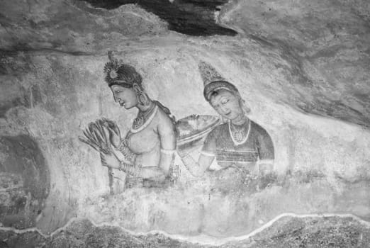 Sigiriya, Sri Lanka - August 9, 2005:  Sigiriya Maidens fresco in Sigiriya, Sri Lanka. Sigiriya Maidens frescoes were painted at Sigiriya rock in five century.