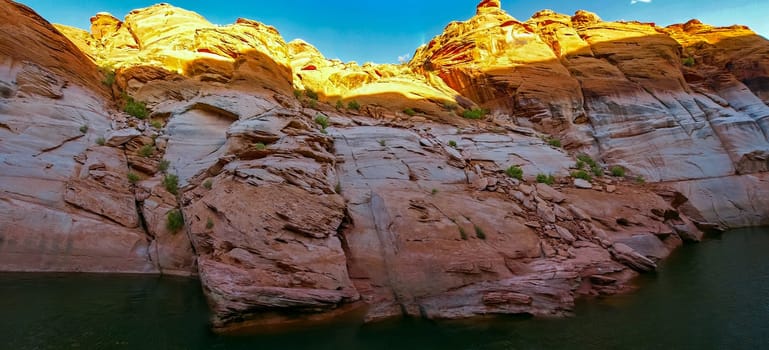 Lake Powell is based on Colorado River with a great view on the canyoon. Beautiful canyon and lonely rocks on the Lake Powell, Utah.
