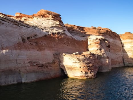 Lake Powell is based on Colorado River with a great view on the canyoon. Beautiful canyon and lonely rocks on the Lake Powell, Utah.