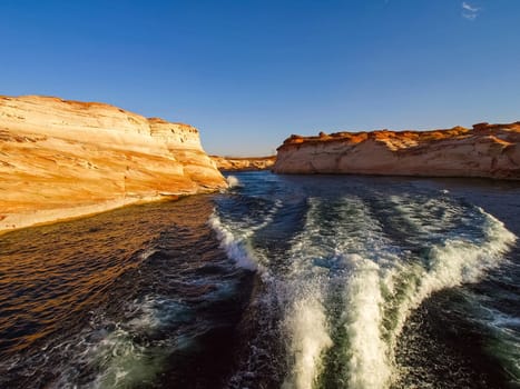 Lake Powell is based on Colorado River with a great view on the canyoon. Beautiful canyon and lonely rocks on the Lake Powell, Utah.
