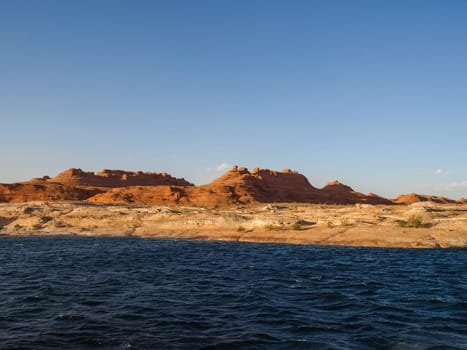 Lake Powell is based on Colorado River with a great view on the canyoon. Beautiful canyon and lonely rocks on the Lake Powell, Utah.