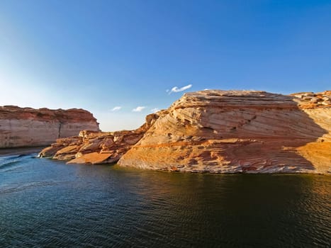 Lake Powell is based on Colorado River with a great view on the canyoon. Beautiful canyon and lonely rocks on the Lake Powell, Utah.