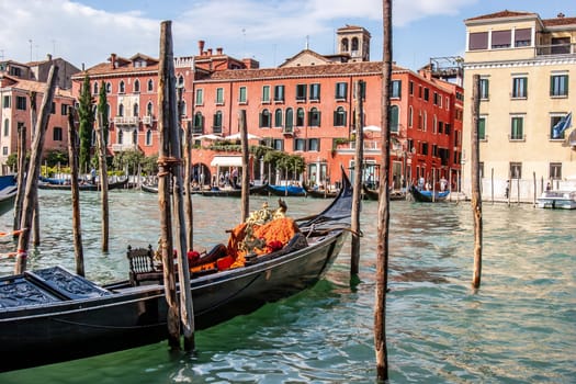Venice, Italy - September 23, 2005: gondola at the pier at the grand canal waiting for tourists in Venice, Italy.