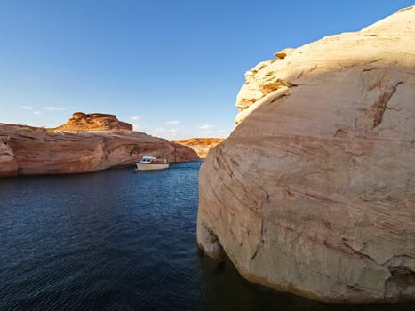 Lake Powell is based on Colorado River with a great view on the canyoon. Beautiful canyon and lonely rocks on the Lake Powell, Utah.
