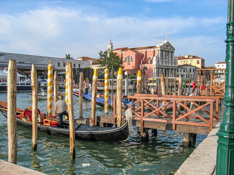 Venice, Italy - September 23, 2005: view to canale Grande in Venice with boats, gondolas and historic villas.