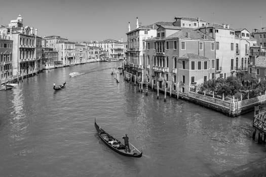 Venice, Italy - April 9, 2007: people enjoy the gondola trip in the Canale Grande in Venice, Italy.