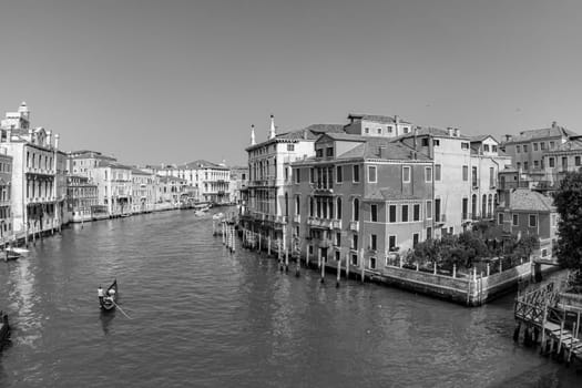 Venice, Italy - April 9, 2007: people enjoy the gondola trip in the Canale Grande in Venice, Italy.