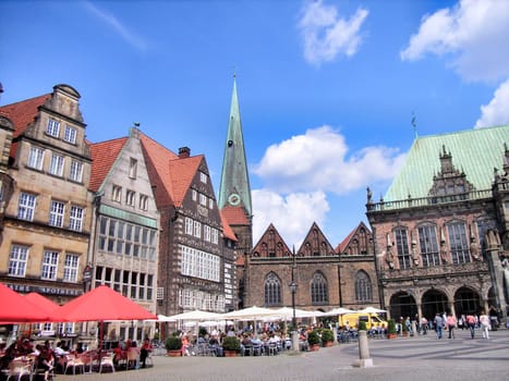 Bremen, Germany - July 22, 2007: view to old town hall of Bremen and the market square with restaurants and tourists.